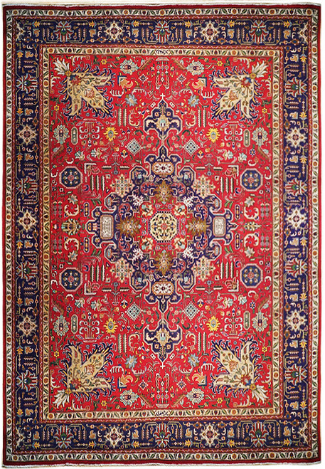 Red Persian Heriz rug with navy medallion frame and ivory octagon center in wool pile