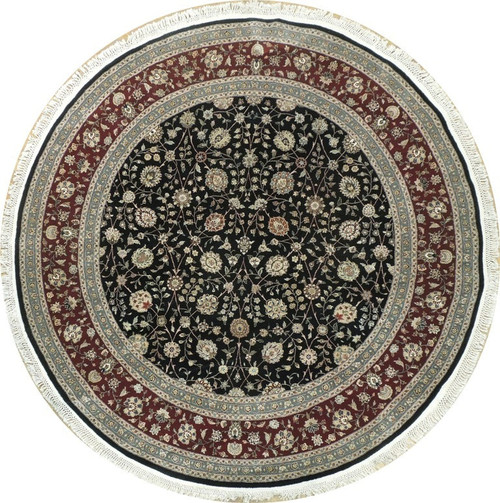 Round black Oriental rug with burgundy floral border, ivory fringe, all-over vine and rosette field