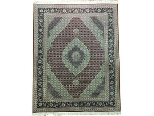 Full view of 8'9" x 11'9" deep red Tabriz design Oriental rug with green medallion
