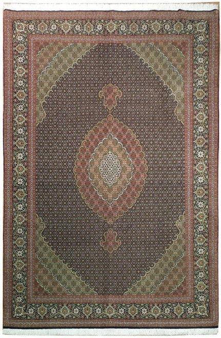 Full overhead view of black field Persian Tabriz Mahi rug with ivory scalloped center medallion