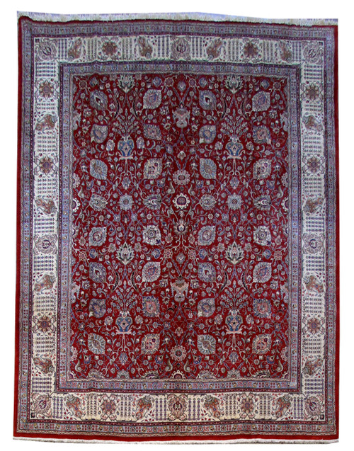 Full overhead view of brick red Persian Tabriz rug with all-over floral field and ivory border