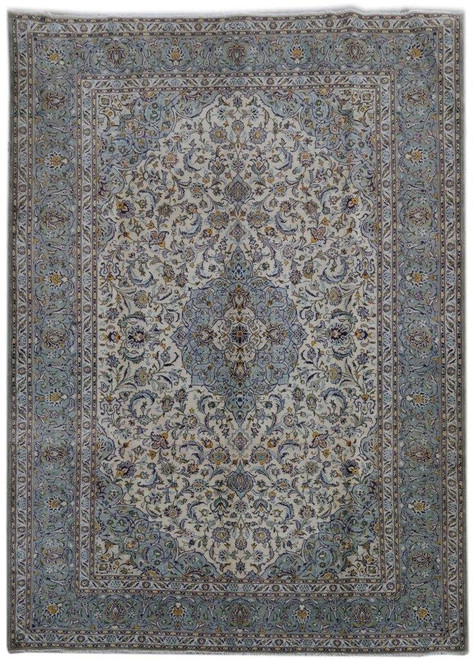 Ivory and soft blue Persian Kashan rug with central floral medallion and ornate border