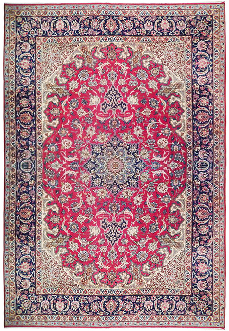 Red field Persian Isfahan rug with navy floral border, ivory spandrels and detailed central medallion