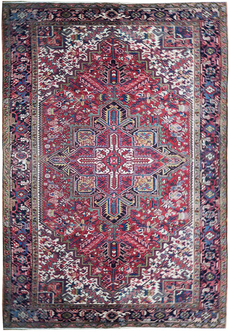 Maroon Persian Heriz rug with navy border, ivory spandrels and geometric star medallion, full overhead view