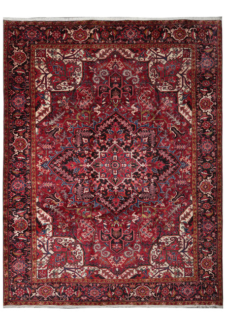 10' x 12'8" Persian Heriz rug shown flat with rustic red field and navy floral border