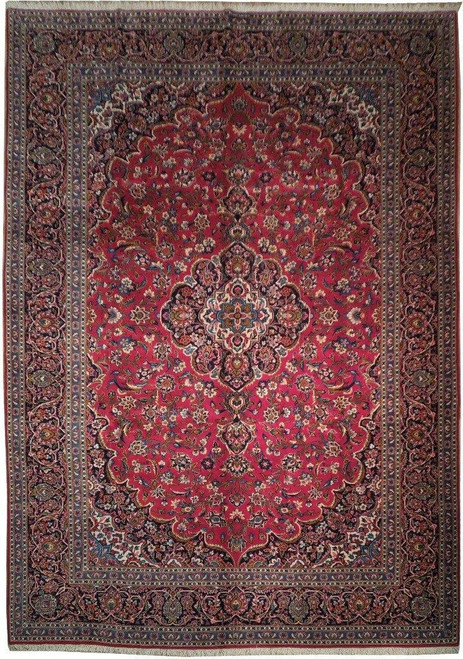 Full view of 10' x 14' Persian Kashan rug with red field and navy floral border