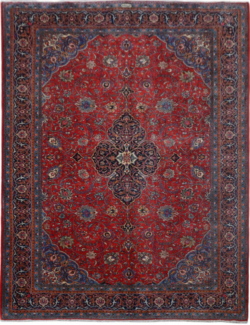10x13 red Persian Sarouk rug shown flat with navy lobed medallion and ivory center