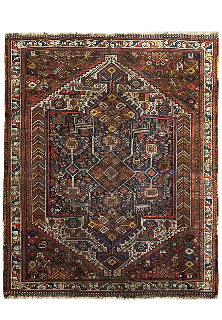 Antique Persian tribal rug 5'3" x 6'3" with navy pole medallion and rust brown field