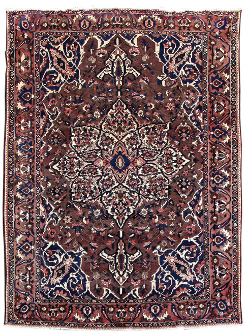 Dark brown Persian Bakhtiar rug with ivory star medallion, navy corner spandrels and rose palmette border