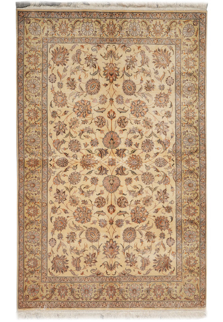 Full overhead view of beige 6x9 Kashan design rug with gold floral border and ivory fringe