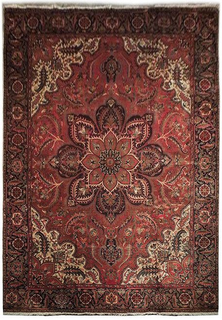 9'4" x 12'3" Persian Heriz rug with salmon field, ivory corner spandrels and navy floral border