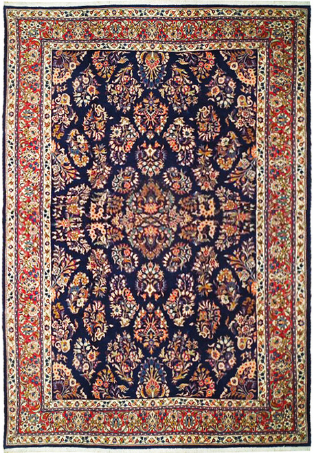 Navy blue 7'4 x 10'3 Persian Sarouk rug with ivory and brick red floral border