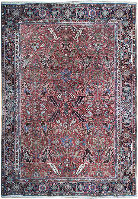Full overhead view of 8 x 11 antique Persian Heriz rug with brick red all-over field