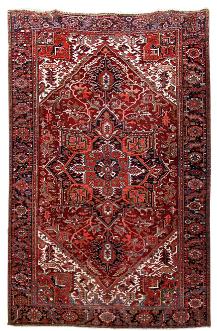 8'1" x 12'3" Persian Heriz rug with red field, navy medallion and ivory corner spandrels
