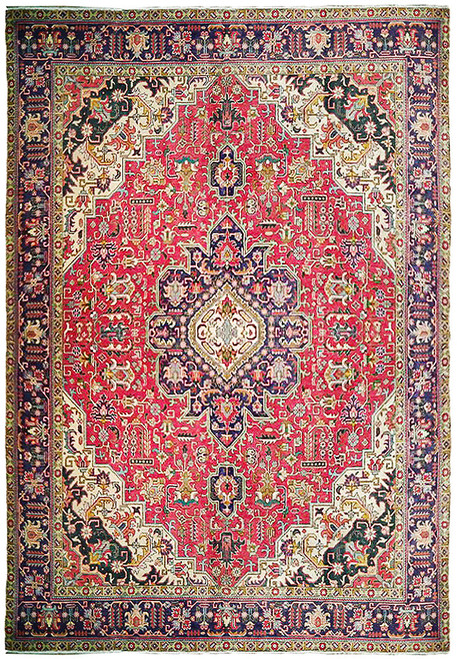 Red field Persian Tabriz rug with navy octagonal medallion, ivory spandrels and floral navy border