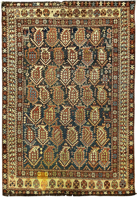 Full overhead view of blue antique Persian tribal rug with all over boteh paisley field