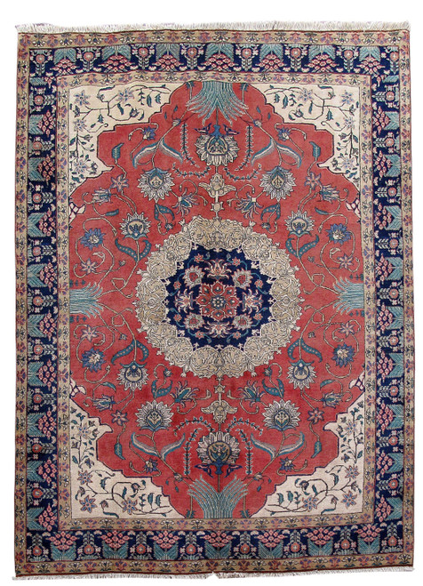 7'9" x 10'10" Persian Tabriz rug with coral red field, navy medallion and ivory floral spandrels