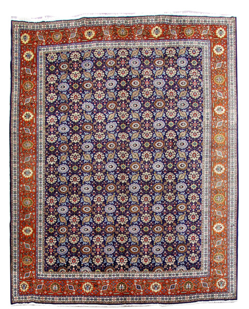 Navy blue Persian Tabriz rug with rust border and all-over rosette field shown flat overhead
