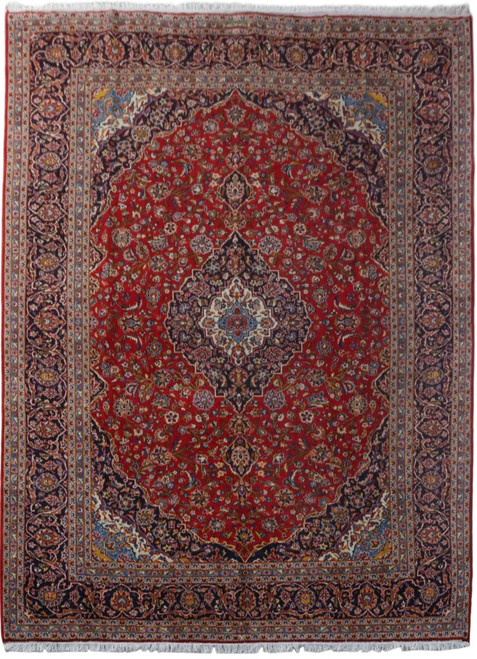 Overhead view of 9'9 x 13'5 Persian Kashan rug with red field and navy floral border