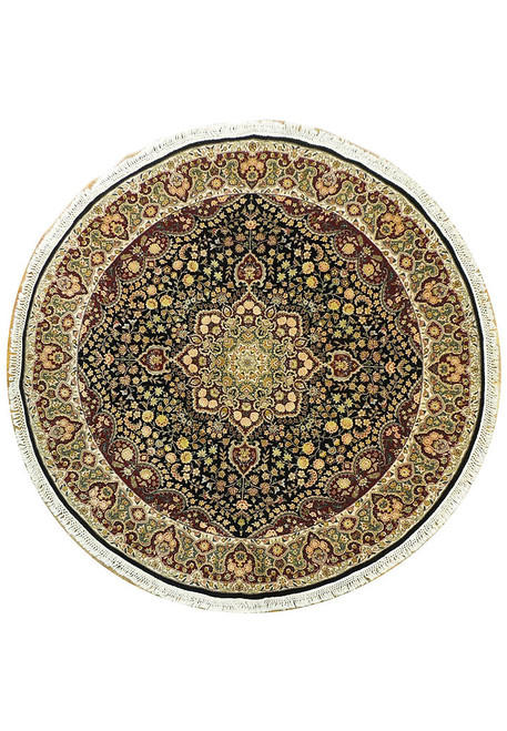Overhead view of round black Oriental rug with ivory border and central floral medallion