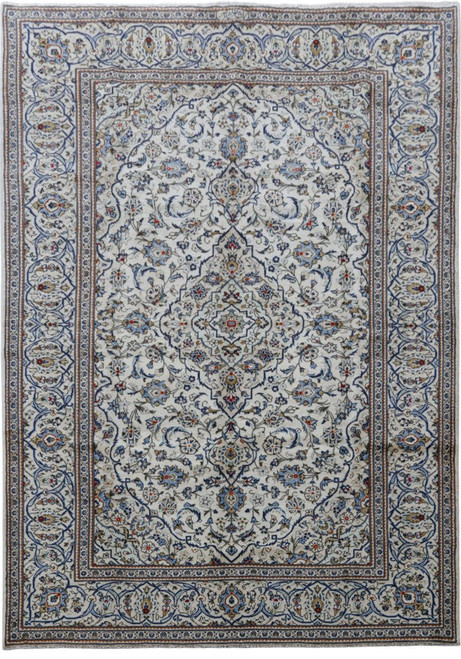 Full overhead view of ivory 8'2" x 11'6" Persian Kashan rug with navy floral medallion