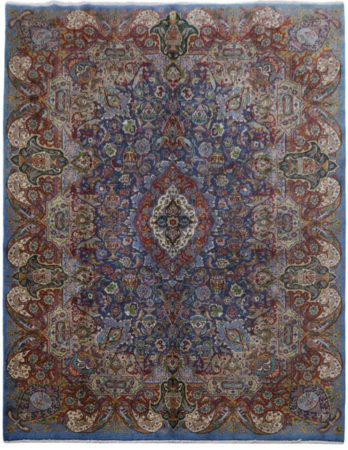 Full overhead view of blue and burgundy Persian Kashmar rug with ivory medallion and vase motifs