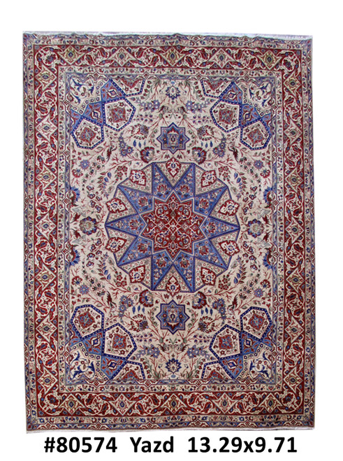 Ivory field Persian Yazd rug with 12 point blue star medallion and deep red floral border