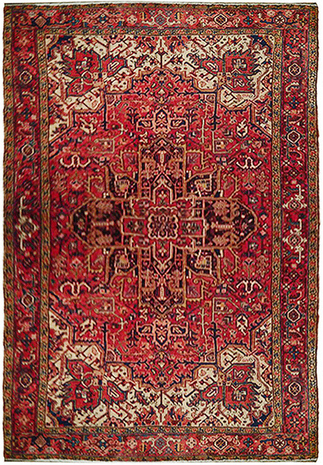 Overhead view of rose red Persian Heriz rug with ivory corner spandrels and geometric medallion
