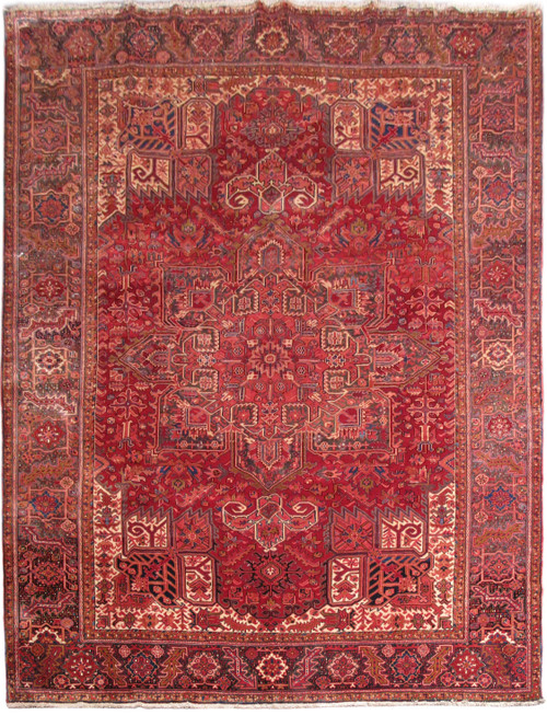 10' x 13'3" Persian Heriz rug with deep red field and ivory geometric corner spandrels