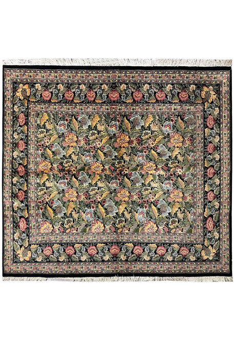 7'3" x 8'2" wool and silk Oriental rug with black ground and dense floral field
