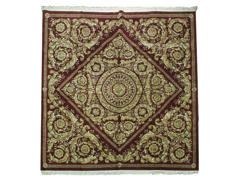 Full view of 10'2" x 10'2" square Savonnerie rug with burgundy field and gold acanthus medallion