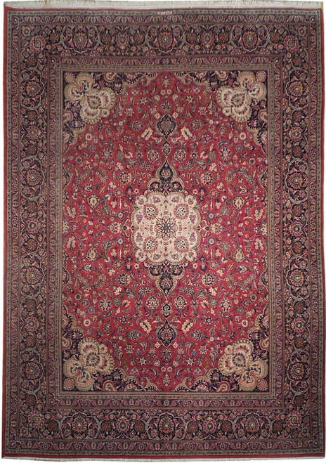 Full overhead view of 10'3" x 13'7" red Persian Kashan rug with ivory medallion and navy border
