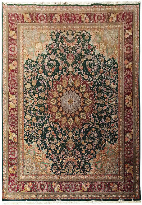 Full view of emerald green 8x10 wool and silk rug with burgundy floral border