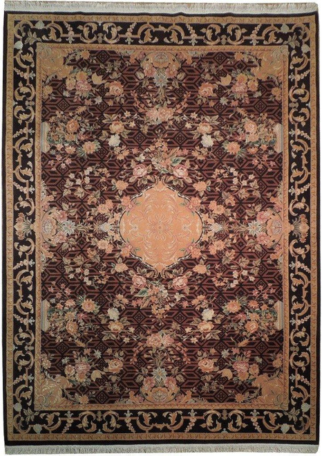 Flat overhead view of burgundy and black wool and silk French Country rug with salmon medallion