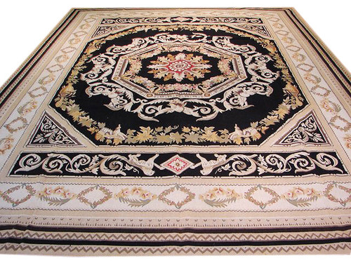 Full view of black and ivory 9x12 Aubusson flat weave rug with floral medallion