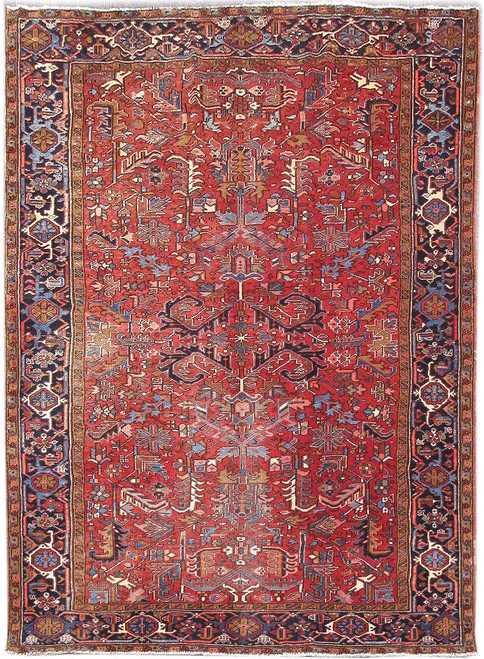 7'7" x 10'8" Persian Heriz rug with brick red field and navy floral border