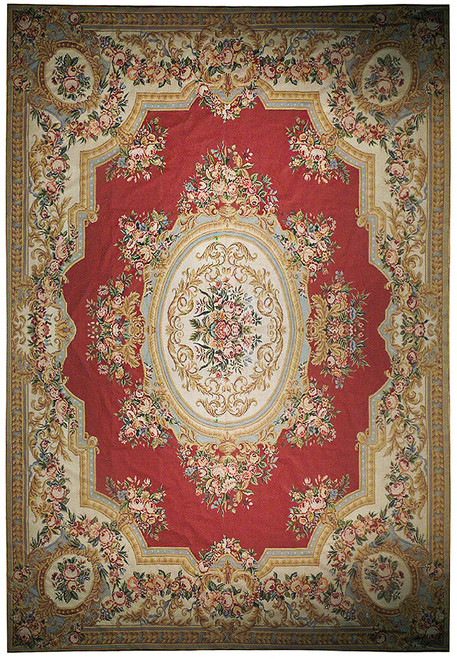 Brick red Aubusson needlepoint rug with ivory floral border, oval medallion and rose garlands