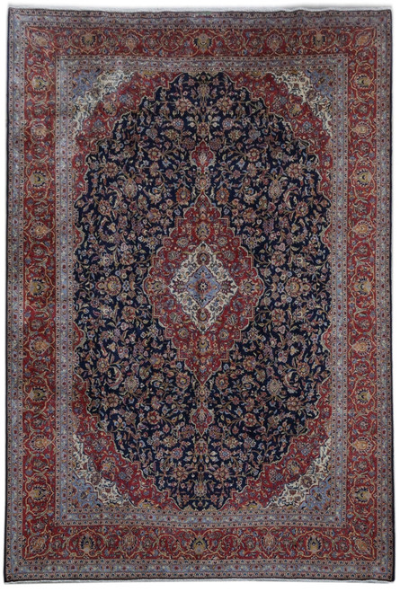 Navy blue Persian Kashan rug with brick red floral medallion and ivory center cartouche