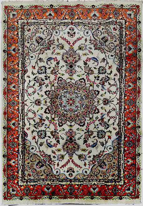 Overhead view of ivory Tabriz rug with coral border, floral medallion and delicate vine scrollwork
