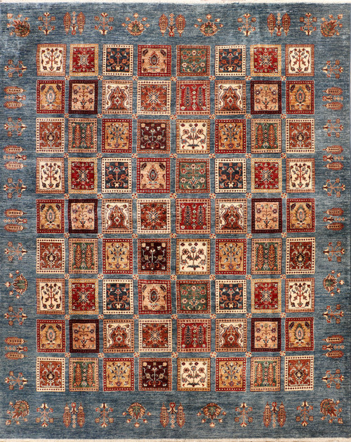 Full overhead view of slate blue Soltani panel rug with multicolor garden squares and floral border
