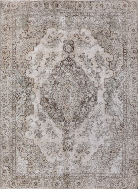 Distressed vintage Persian rug in pastel light gray with soft brown floral medallion, full overhead view
