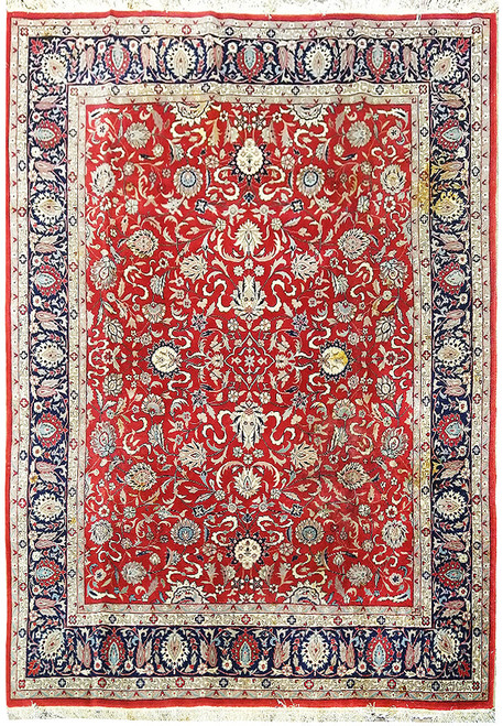 Full view of red Kashan design rug with ivory floral vines and deep navy main border