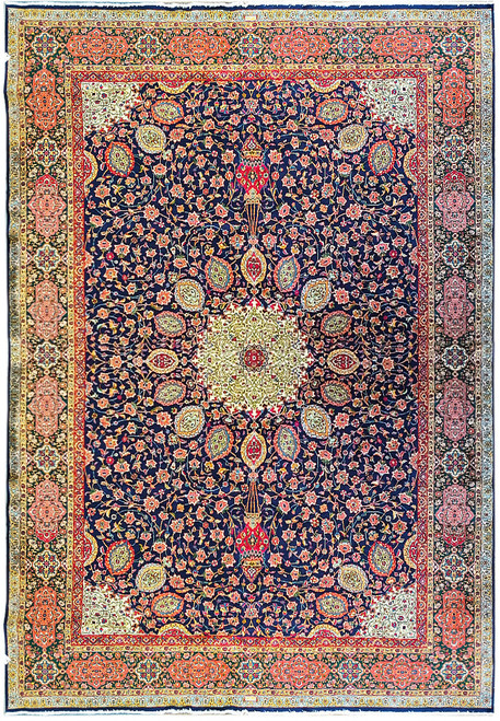 Overhead view of navy Sheik Safi Tabriz rug with ivory medallion and green border