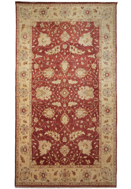 Full overhead view of rust red Agra rug with wide beige gold floral border