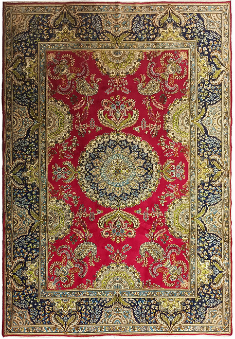 Overhead view of 8x11 Persian Kerman rug with rose red field and navy floral borders
