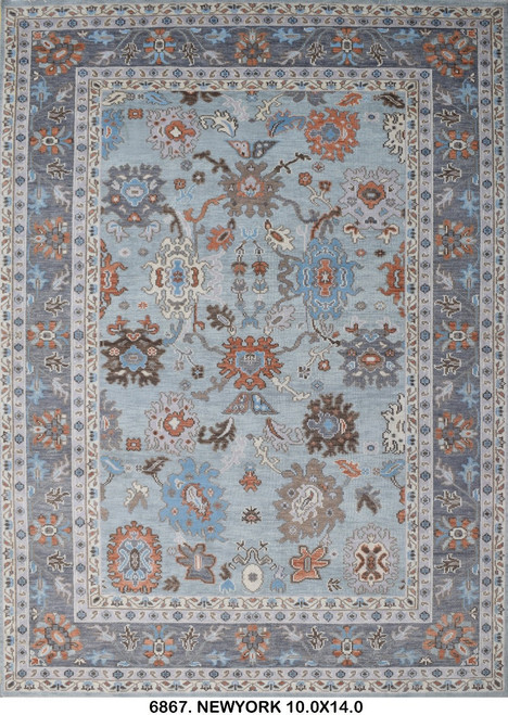 Full view of 10x14 Oushak rug with light blue field, gray border and rust palmettes