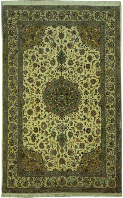 Full view of cream 6'7" x 10'2" Persian Tabriz rug with sage green center medallion