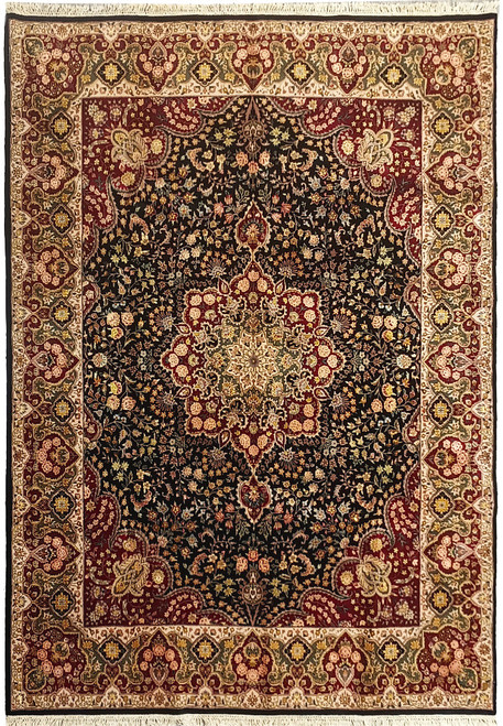Black and burgundy Tabriz design Oriental rug with ivory floral border, full overhead view