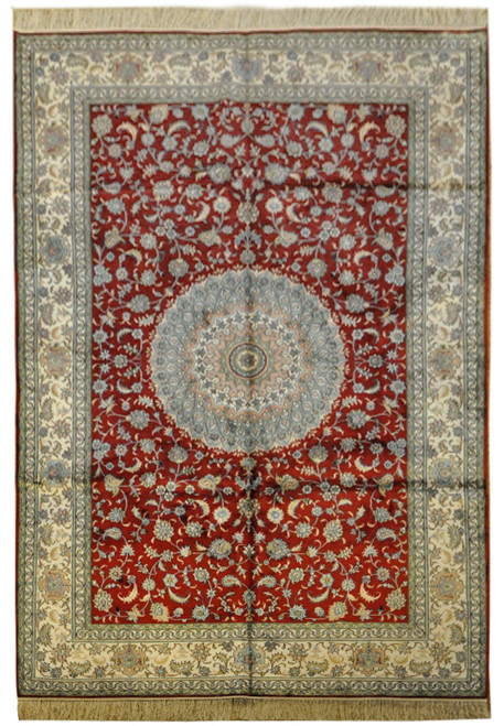 Ruby red silk rug with pale star medallion, ivory floral border and all-over vine field