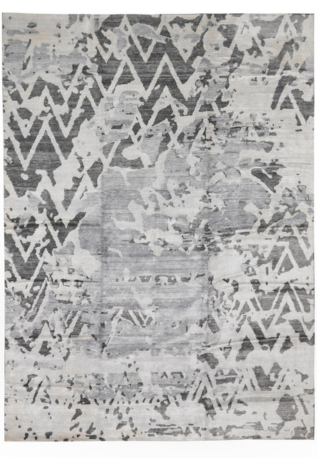 10x14 modern gray rug shown flat with charcoal chevrons dissolving across ivory abstract field